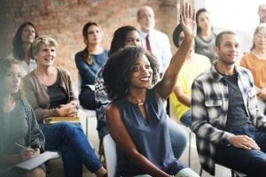 A group of diverse audience in a meeting